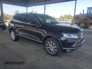 2017 Volkswagen Touareg Sport with VIN WVGEF7BP8HD000237, listed as a Copart auction lot 52714074 with 107,463 mi miles and . Bid and sale history available at DreamBid. Image 4.
