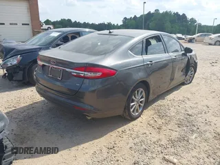 2017 Ford Fusion SE z VIN 3FA6P0H71HR410878, wystawiony jako IAAI lot #42135622 z przebiegiem 99 462 mil mil oraz . Historia ofert i sprzedaży dostępna na DreamBid. Obrazek 4.