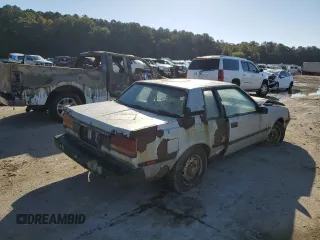 1984 Toyota Celica z VIN JT2RA64C7E6218560, wystawiony jako Copart lot #63087872 z przebiegiem 168 288 mil mil oraz Czysty tytuł • Clean title. Historia ofert i sprzedaży dostępna na DreamBid. Obrazek 4.