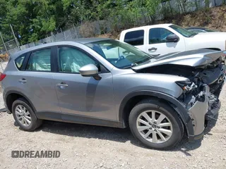 2014 Mazda CX-5 Sport with VIN JM3KE2BEXE0329303, listed as a IAAI auction lot 42556908 with 127,836 mi miles and . Bid and sale history available at DreamBid. Image 13.