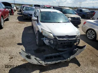 2014 Ford Focus Titanium with VIN 1FADP3J26EL132223, listed as a Copart auction lot 71490004 with 131,233 mi miles and Salvage Title. Bid and sale history available at DreamBid. Image 5.