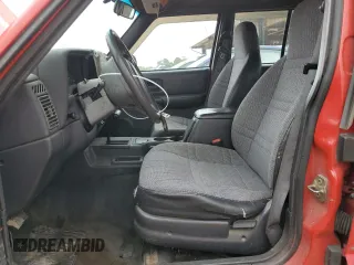 1999 Jeep Cherokee Sport with VIN 1J4FT68S2XL580915, listed as a Copart auction lot 50374875 with 286,276 mi miles and Salvage Title. Bid and sale history available at carsss.com. Image 7.