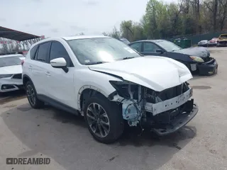 2016 Mazda CX-5 Grand Touring with VIN JM3KE4DY6G0618121, listed as a IAAI auction lot 41958805 with 101,232 mi miles. Bid and sale history available at carsss.com. Image 1.