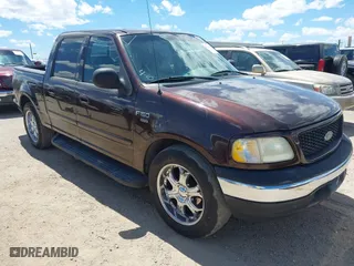 2001 Ford F-150 SuperCrew XLT with VIN 1FTRW07W01KE16734, listed as a IAAI auction lot 42018009 with 1 mi miles. Bid and sale history available at carsss.com. Image 1.
