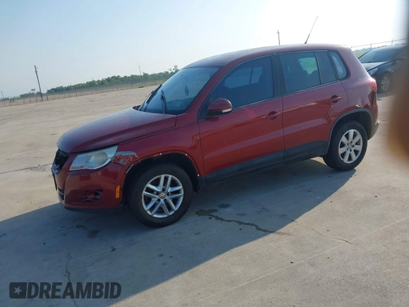 2011 Volkswagen Tiguan SEL w/Premium Navi with VIN WVGAV7AX4BW001402, listed as a IAAI auction lot 42406619 with 183,035 mi miles and . Bid and sale history available at DreamBid. Image 2.
