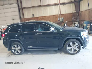 2014 Jeep Grand Cherokee Limited z VIN 1C4RJFBG2EC320282, wystawiony jako IAAI lot #42067273 z przebiegiem 78 061 mil mil oraz . Historia ofert i sprzedaży dostępna na DreamBid. Obrazek 13.