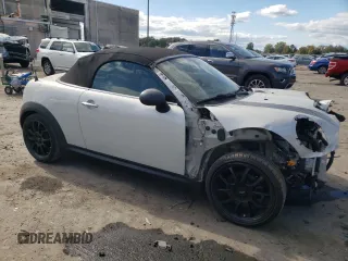 2012 MINI Roadster S z VIN WMWSY3C57CT144767, wystawiony jako Copart lot #76274884 z przebiegiem 44 896 mil mil oraz Tytuł czysty. Historia ofert i sprzedaży dostępna na DreamBid. Obrazek 4.