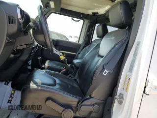 2015 Jeep Wrangler Unlimited Rubicon with VIN 1C4BJWFG6FL508493, listed as a Copart auction lot 54788635 with 127,694 mi miles and Salvage title. Bid and sale history available at DreamBid. Image 7.