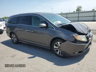 2014 Honda Odyssey Touring with VIN 5FNRL5H93EB061754, listed as a Copart auction lot 55182015 with 168,058 mi miles and Salvage title. Bid and sale history available at DreamBid. Image 4.