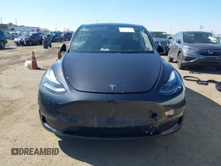 2024 Tesla Model Y with VIN 7SAYGDED8RF213796, listed as a IAAI auction lot 41634130 with 7,710 mi miles and . Bid and sale history available at DreamBid. Image 11.