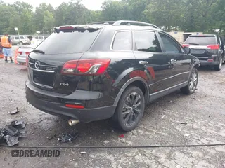 2015 Mazda CX-9 Grand Touring with VIN JM3TB2DA1F0464517, listed as a IAAI auction lot 42484985 with 104,932 mi miles and . Bid and sale history available at DreamBid. Image 4.