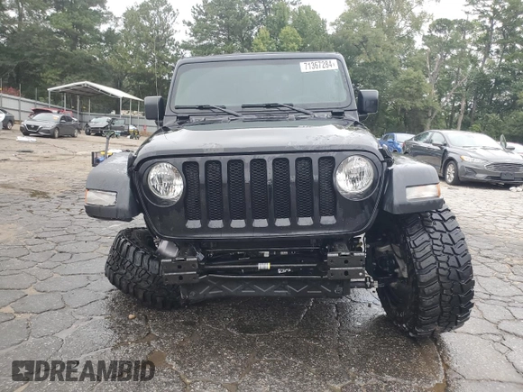 2023 Jeep Wrangler Sport with VIN 1C4HJXDN9PW638737, listed as a Copart auction lot 71367284 with 12,054 mi miles and Salvage Title. Bid and sale history available at DreamBid. Image 5.