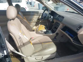 1997 Honda Accord EX w/Leather with VIN 1HGCD7158VA014025, listed as a IAAI auction lot 41582343 with 302,660 mi miles. Bid and sale history available at carsss.com. Image 5.
