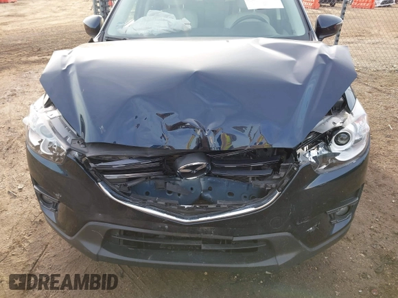 2016 Mazda CX-5 Grand Touring with VIN JM3KE4DY1G0823989, listed as a IAAI auction lot 41770149 with 40,677 mi miles. Bid and sale history available at carsss.com. Image 6.