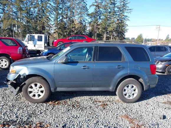 2010 Mazda Tribute Touring with VIN 4F2CY9C73AKM04595, listed as a IAAI auction lot 40797681 with 122,774 mi miles. Bid and sale history available at carsss.com. Image 14.