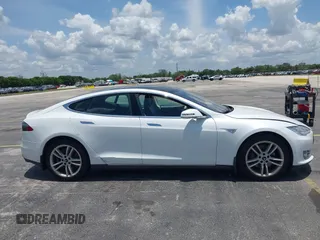 2013 Tesla Model S with VIN 5YJSA1CG4DFP21658, listed as a IAAI auction lot 42398609 with 116,068 mi miles and . Bid and sale history available at DreamBid. Image 13.