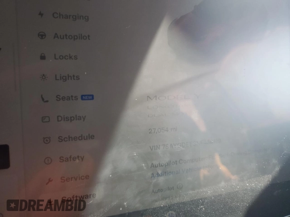 2022 Tesla Model Y Long Range z VIN 7SAYGDEE3NF436119, wystawiony jako Copart lot #54892115 z przebiegiem 27 054 mil mil oraz Szkody całkowita. Historia ofert i sprzedaży dostępna na DreamBid. Obrazek 9.
