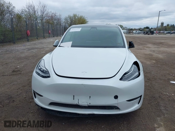 2022 Tesla Model Y Long Range with VIN 7SAYGDEE1NF421098, listed as a IAAI auction lot 42177555 with 55,855 mi miles and . Bid and sale history available at carsss.com. Image 13.