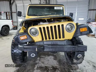 2002 Jeep Wrangler Sport z VIN 1J4FA49S02P730417, wystawiony jako Copart lot #59620865 z przebiegiem Nie podano mil oraz Szkoda całkowita • Salvage title. Historia ofert i sprzedaży dostępna na DreamBid. Obrazek 5.