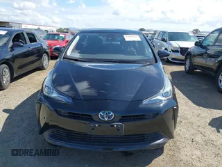 2021 Toyota Prius L Eco with VIN JTDKAMFU6M3135799, listed as a IAAI auction lot 42064241 with 77,120 mi miles and . Bid and sale history available at DreamBid. Image 12.