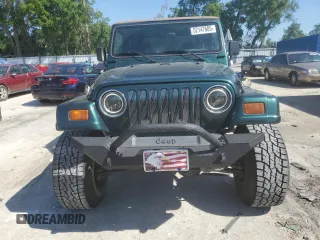 1999 Jeep Wrangler Sahara with VIN 1J4FY49S6XP478675, listed as a Copart auction lot 52147605 with 157,971 mi miles and Salvage Title. Bid and sale history available at carsss.com. Image 5.