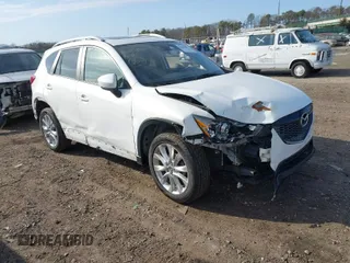 2014 Mazda CX-5 Grand Touring with VIN JM3KE4DY7E0425201, listed as a IAAI auction lot 41803597 with 118,867 mi miles. Bid and sale history available at carsss.com. Image 1.
