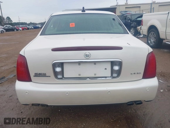 2002 Cadillac DeVille DHS z VIN 1G6KE57YX2U212020, wystawiony jako IAAI lot #41287342 z przebiegiem Nie podano mil oraz . Historia ofert i sprzedaży dostępna na DreamBid. Obrazek 16.