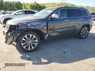 2017 Jeep Grand Cherokee Overland with VIN 1C4RJFCG9HC601806, listed as a Copart auction lot 61786275 with 122,898 mi miles and Salvage title. Bid and sale history available at DreamBid. Image 1.