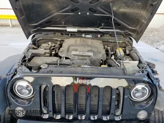 2015 Jeep Wrangler Freedom Edition with VIN 1C4AJWAG8FL541675, listed as a Copart auction lot 62647855 with 53,915 mi miles and Salvage title. Bid and sale history available at DreamBid. Image 12.