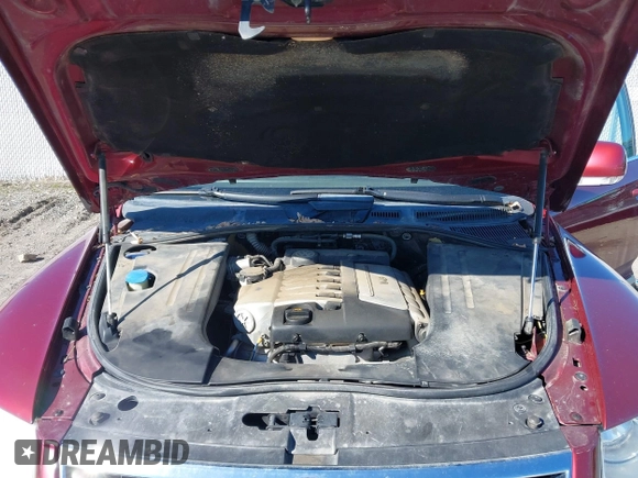 2004 Volkswagen Touareg z VIN WVGBC67L24D004600, wystawiony jako IAAI lot #42283582 z przebiegiem 192 135 mil mil oraz . Historia ofert i sprzedaży dostępna na DreamBid. Obrazek 10.