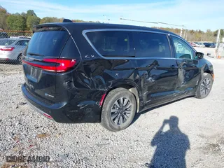 2023 Chrysler Pacifica Hybrid Touring L with VIN 2C4RC1L79PR592477, listed as a IAAI auction lot 40823333 with 8,729 mi miles. Bid and sale history available at carsss.com. Image 4.