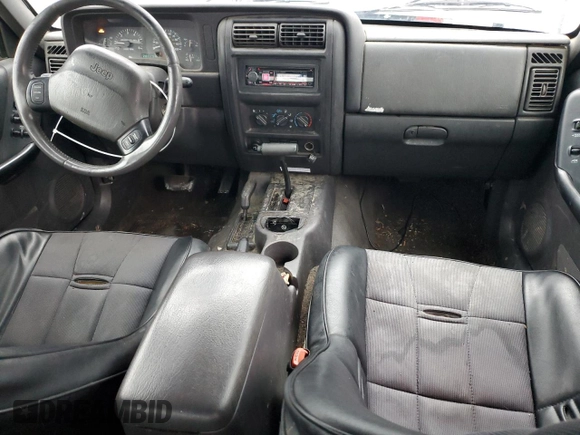 1999 Jeep Cherokee Sport with VIN 1J4FF68S4XL567848, listed as a Copart auction lot 43222045 with 280,178 mi miles and Salvage title. Bid and sale history available at DreamBid. Image 8.