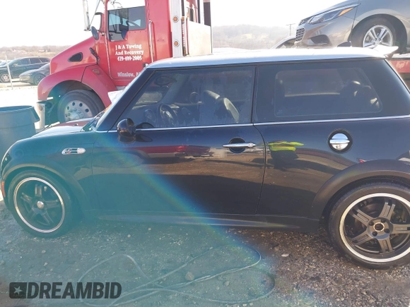2006 MINI Hardtop S with VIN WMWRE33546TJ34712, listed as a IAAI auction lot 41144701 with 230,006 mi miles and . Bid and sale history available at DreamBid. Image 14.