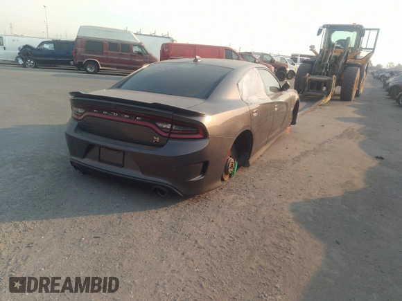 2019 Dodge Charger Scat Pack with VIN 2C3CDXGJ2KH564051, listed as a IAAI auction lot 41255283 with 64,687 mi miles and . Bid and sale history available at DreamBid. Image 4.