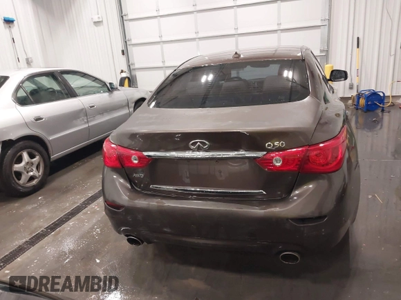 2015 Infiniti Q50 Premium z VIN JN1BV7ARXFM418280, wystawiony jako IAAI lot #42080879 z przebiegiem 126 411 mil mil oraz . Historia ofert i sprzedaży dostępna na DreamBid. Obrazek 16.