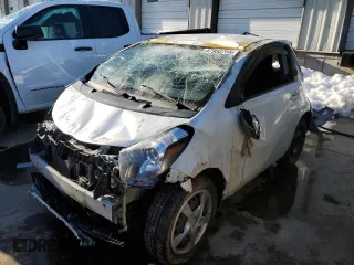 2014 Scion iQ with VIN JTNJJXB04EJ028842, listed as a Copart auction lot 87958765 with 146,514 mi miles and Salvage Title. Bid and sale history available at carsss.com. Image 1.