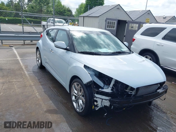 2015 Hyundai Veloster z VIN KMHTC6AD8FU222744, wystawiony jako IAAI lot #42129397 z przebiegiem Nie podano mil oraz . Historia ofert i sprzedaży dostępna na DreamBid. Obrazek 1.
