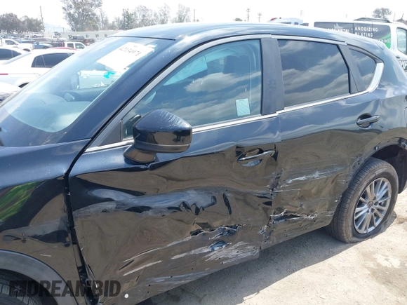 2017 Mazda CX-5 Touring with VIN JM3KFACL0H0124632, listed as a IAAI auction lot 42134971 with 107,029 mi miles and . Bid and sale history available at carsss.com. Image 6.