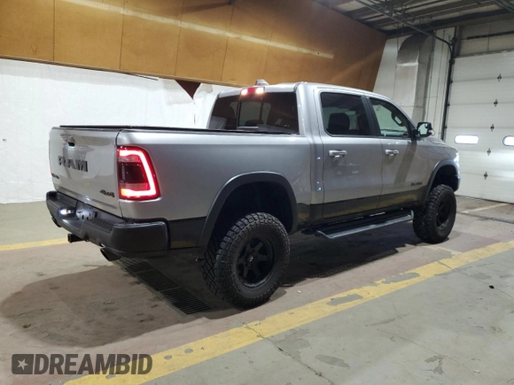 2022 Ram 1500 Rebel z VIN 1C6SRFLT1NN258780, wystawiony jako Copart lot #53040405 z przebiegiem 27 307 mil mil oraz Szkoda całkowita • Salvage title. Historia ofert i sprzedaży dostępna na DreamBid. Obrazek 3.