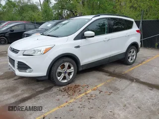 2016 Ford Escape SE with VIN 1FMCU9GX1GUC04085, listed as a IAAI auction lot 42126826 with 130,728 mi miles. Bid and sale history available at carsss.com. Image 2.