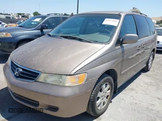 2003 Honda Odyssey EX-L with VIN 5FNRL18993B127164, listed as a IAAI auction lot 42474080 with 152,838 mi miles and . Bid and sale history available at DreamBid. Image 2.