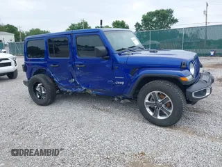 2019 Jeep Wrangler Unlimited Sahara with VIN 1C4HJXEG1KW599117, listed as a IAAI auction lot 42602241 with 109,552 mi miles and . Bid and sale history available at DreamBid. Image 1.