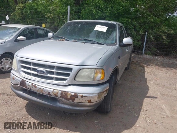 2001 Ford F-150 with VIN 2FTZX17221CB01390, listed as a IAAI auction lot 42194407 with 239,834 mi miles and . Bid and sale history available at DreamBid. Image 2.