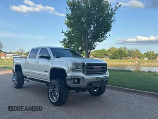 2015 GMC Sierra 1500 SLT with VIN 3GTU2VEC0FG239547, listed as a Copart auction lot 54957305 with 135,497 mi miles and Clean Title. Bid and sale history available at DreamBid. Image 1.