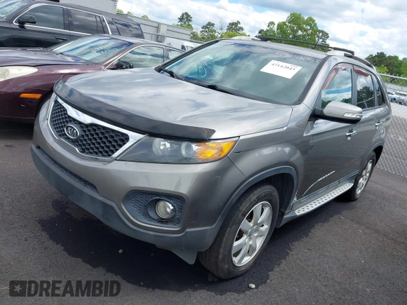 2012 Kia Sorento LX with VIN 5XYKT3A60CG285902, listed as a IAAI auction lot 42142043 with 225,206 mi miles and . Bid and sale history available at carsss.com. Image 2.