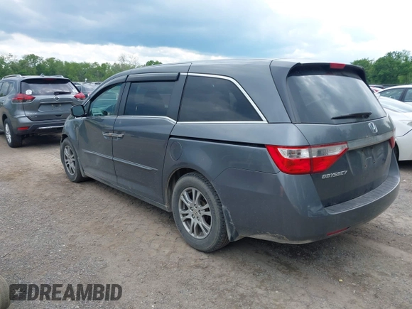2012 Honda Odyssey EX z VIN 5FNRL5H45CB084342, wystawiony jako IAAI lot #42329303 z przebiegiem 173 711 mil mil oraz . Historia ofert i sprzedaży dostępna na DreamBid. Obrazek 3.