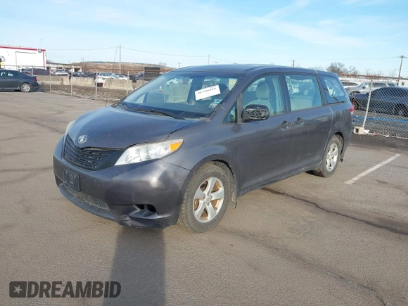2012 Toyota Sienna with VIN 5TDZK3DCXCS258843, listed as a IAAI auction lot 41700446 with 207,384 mi miles. Bid and sale history available at carsss.com. Image 2.