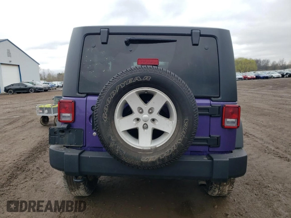 2017 Jeep Wrangler Willys Wheeler with VIN 1C4AJWAG0HL641188, listed as a Copart auction lot 52814005 with 94,959 mi miles and Salvage Title. Bid and sale history available at DreamBid. Image 6.