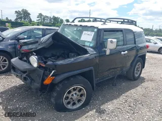 2013 Toyota FJ Cruiser with VIN JTEBU4BF2DK173157, listed as a IAAI auction lot 39718611 with 178,886 mi miles. Bid and sale history available at carsss.com. Image 2.