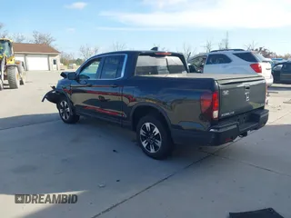 2020 Honda Ridgeline RTL with VIN 5FPYK3F59LB023212, listed as a IAAI auction lot 40704228 with 73,259 mi miles and . Bid and sale history available at DreamBid. Image 3.